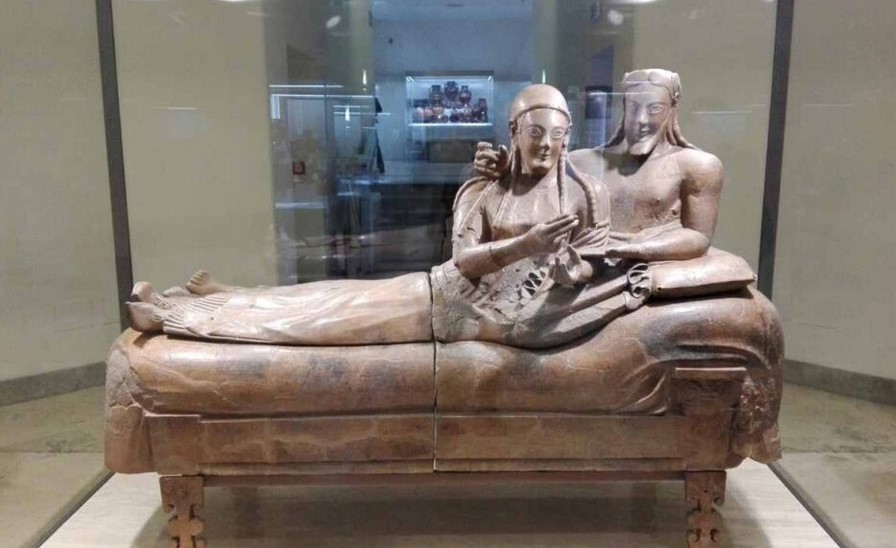 On April 9, 1881, came to light in countless fragments, the Sarcophagus of the Spouses (or Sarcophagus with Reclining Couple) at the Banditaccia necropolis, eastbound, Cerveteri, Italy, c. 530-520 BCE, painted terracotta, 3 feet 9 1/2 inches x 6 feet 7 inches (at the National Etruscan Museum in Rome's Villa Giulia). Reassembled from about four hundred fragments, the Sarcophagus of the spouses is actually an urn intended to accommodate the material remains of the deceased.