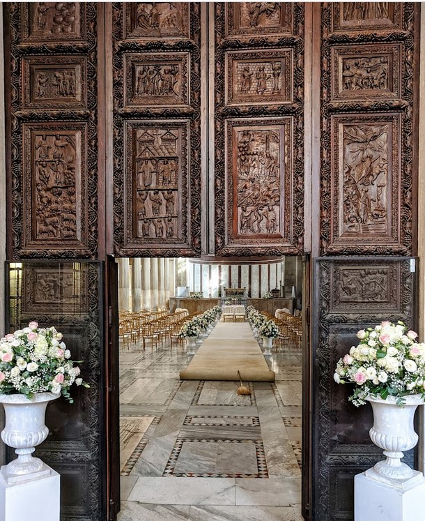 Wooden door of the basilica of Santa Sabina in Rome. A figuration of acclamatio from 425-450 CE is in a panel of the wooden door of the basilica of Santa Sabina in Rome, where it depicts the presentation of a sovereign to the people. The doorposts of this portal are made from frames of Roman age; its 18 panels carved in relief (but once, the original ones were in all 28) depict Scenes of the Old and New Testament.